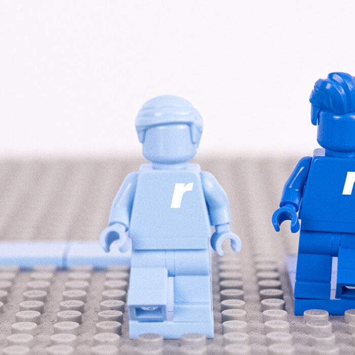 Blue Robotron-branded toy figures with the letter r