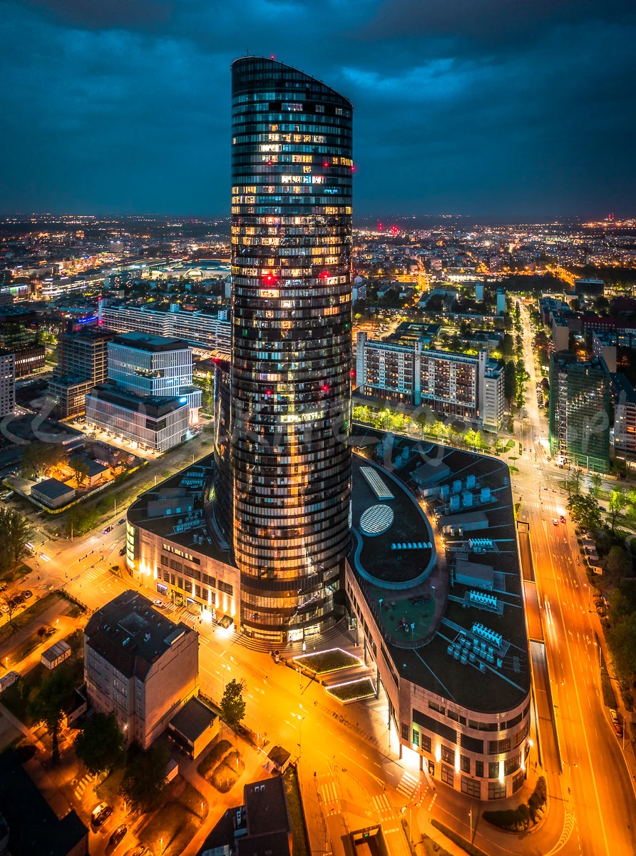 Sky Tower rising above Wrocław at night